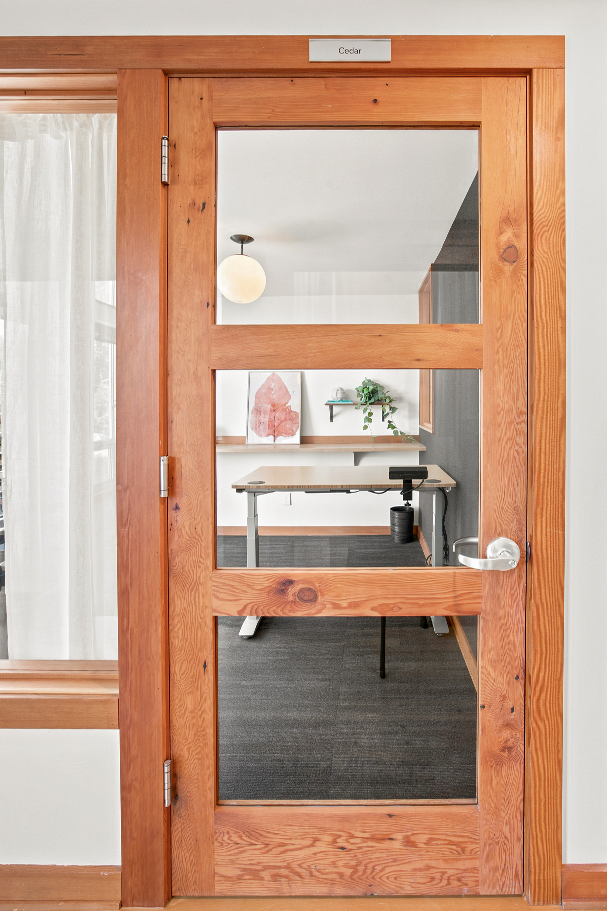 Private office at The Grove with natural wood details and a height-adjustable desk, Ladd’s Addition, Portland